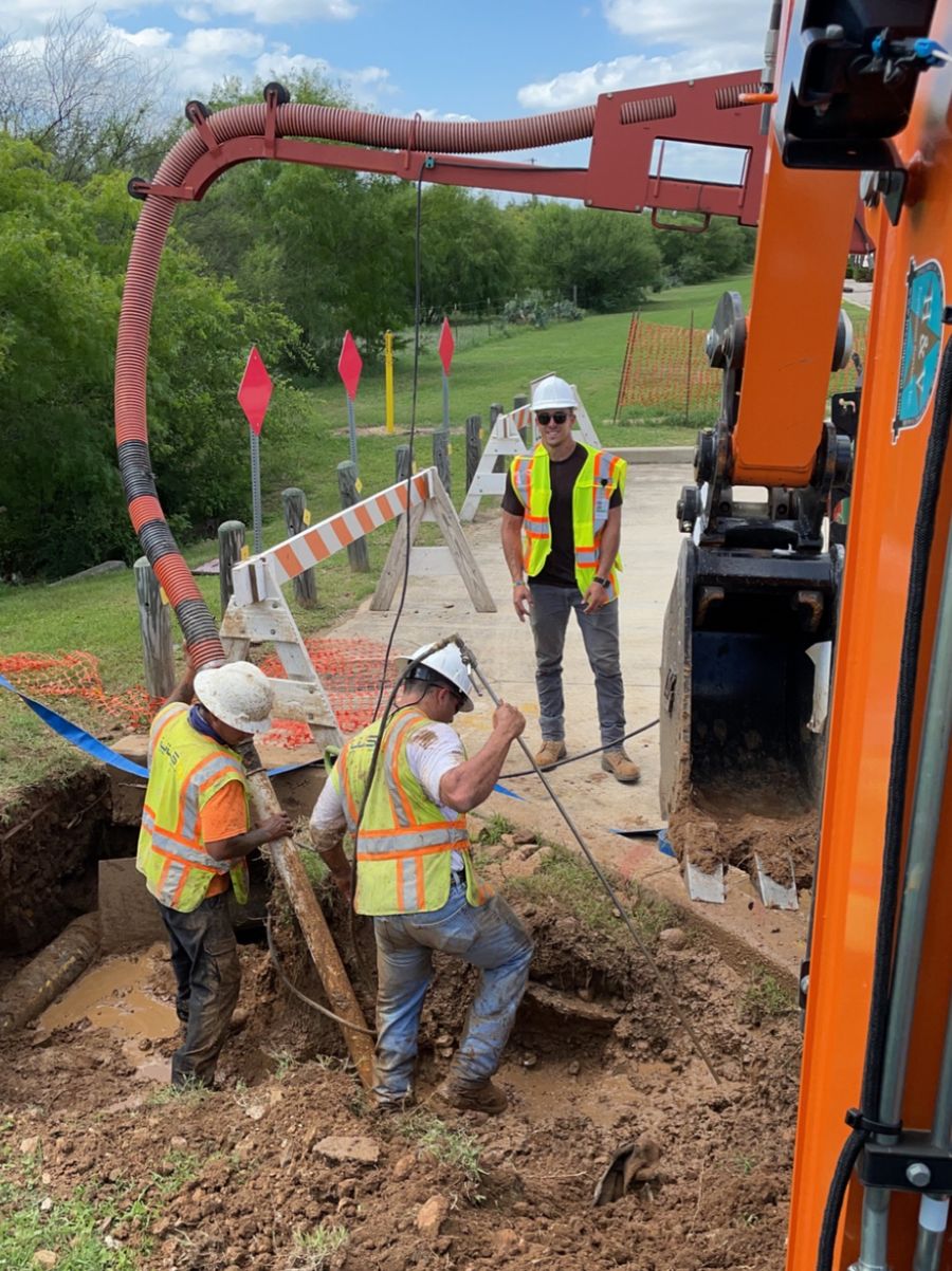 SF Excavation crew working an underground utility repair on a South Texas job site